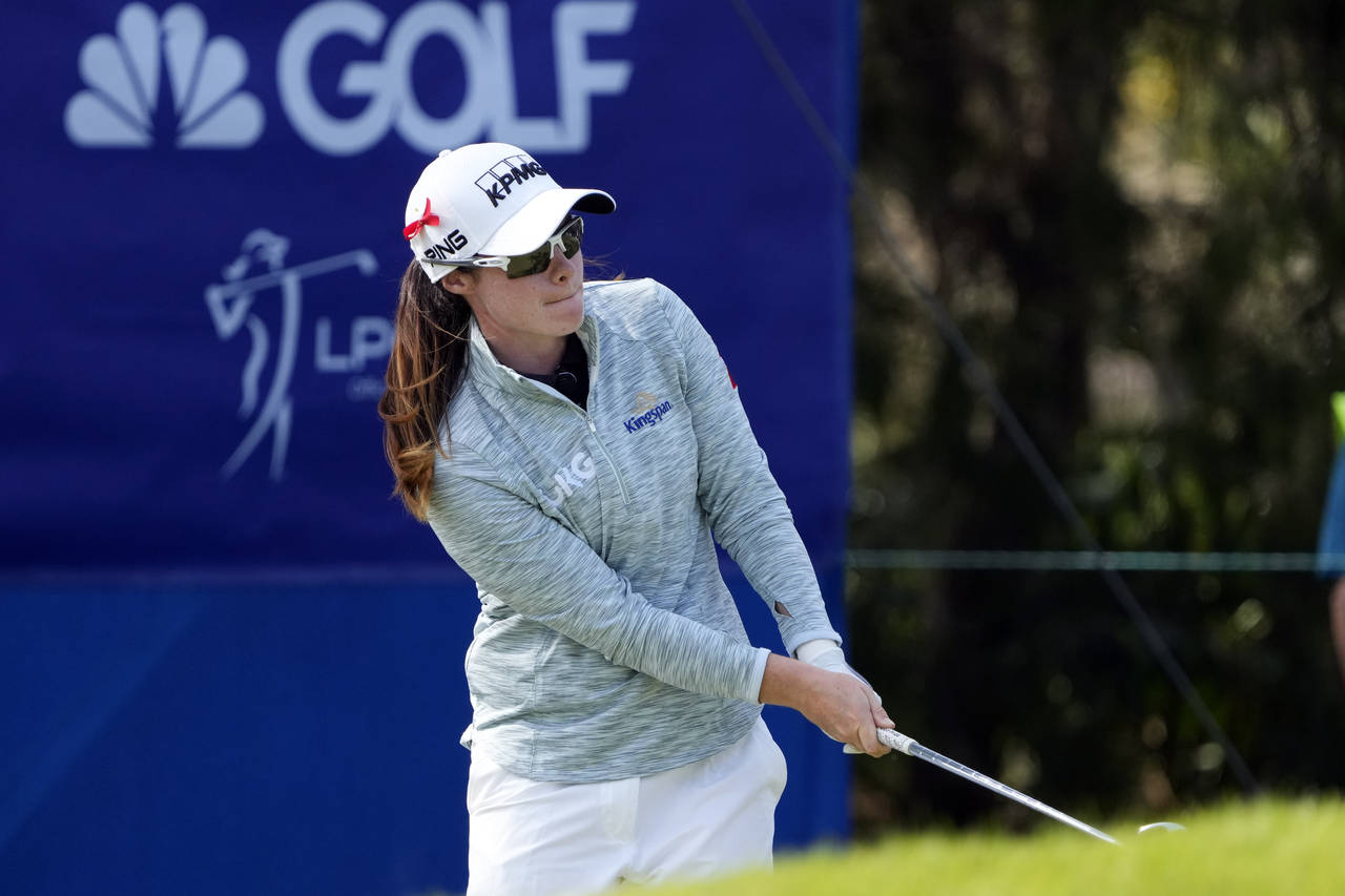 Leona Maguire, of Ireland, hits a shot to the green on the eighth hole during the first round of th...
