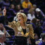 
              LSU head coach Kim Mulkey calls out from the bench in the first half an NCAA college basketball game against Arkansas in Baton Rouge, La., Thursday, Jan. 19, 2023. (AP Photo/Gerald Herbert)
            