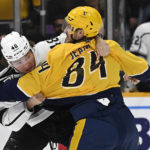 
              Los Angeles Kings center Blake Lizotte (46) fights with Nashville Predators left wing Tanner Jeannot (84) during the first period of an NHL hockey game Saturday, Jan. 21, 2023, in Nashville, Tenn. (AP Photo/Mark Zaleski)
            