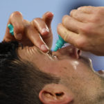 
              Novak Djokovic of Serbia puts eye drops in his eyes during break in his semifinal against Tommy Paul of the U.S. at the Australian Open tennis championship in Melbourne, Australia, Friday, Jan. 27, 2023. (AP Photo/Asanka Brendon Ratnayake)
            