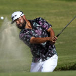
              J.J. Spaun hits from the bunker on the 18th green during the second round of the Sony Open golf tournament, Friday, Jan. 13, 2023, at Waialae Country Club in Honolulu. (AP Photo/Matt York)
            