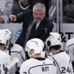 
              Los Angeles Kings Head coach Todd Mclellan, top, talks to players during the third period of an NHL hockey game against the Chicago Blackhawks in Chicago, Sunday, Jan. 22, 2023. (AP Photo/Nam Y. Huh)
            