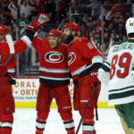
              Carolina Hurricanes' Brent Burns celebrates his goal against the Minnesota Wild with Paul Stastny, second from right, Martin Necas (88) and Andrei Svechnikov (37) during the second period of an NHL hockey game in Raleigh, N.C., Thursday, Jan. 19, 2023. (AP Photo/Karl B DeBlaker)
            