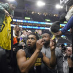 
              Cleveland Cavaliers guard Donovan Mitchell signs autographs before the team's NBA basketball game against the Utah Jazz on Tuesday, Jan. 10, 2023, in Salt Lake City. (AP Photo/Rick Bowmer)
            