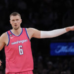 
              Washington Wizards center Kristaps Porzingis gestures after shooting a 3-point basket during the second half of the team's NBA basketball game against the New York Knicks, Wednesday, Jan. 18, 2023, at Madison Square Garden in New York. The Wizards won 116-105. (AP Photo/Mary Altaffer)
            