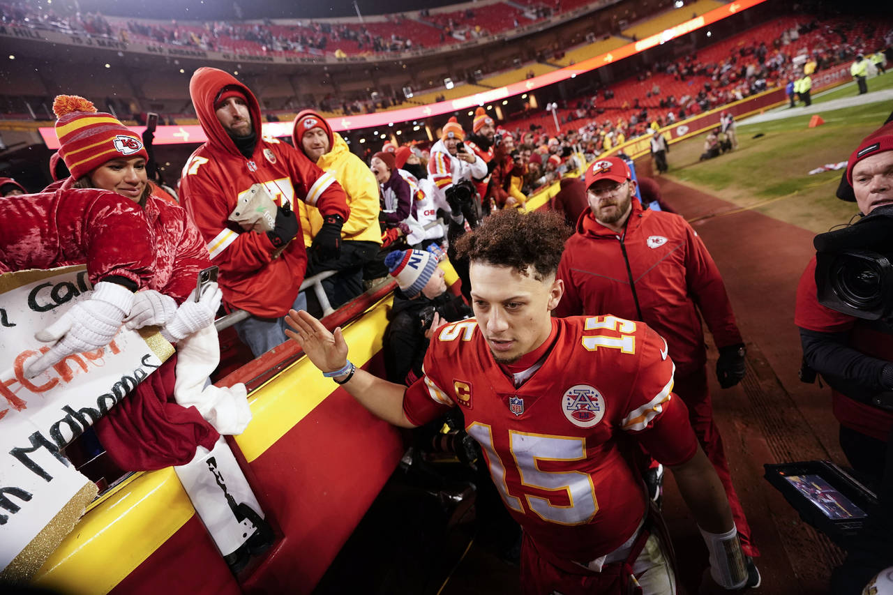 Kansas City Chiefs quarterback Patrick Mahomes (15) speaks with fans after an NFL divisional round ...