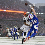 
              Cincinnati Bengals safety Dax Hill (23) breaks up a pass intended for Buffalo Bills tight end Dawson Knox (88) during the third quarter of an NFL division round football game, Sunday, Jan. 22, 2023, in Orchard Park, N.Y. (AP Photo/Adrian Kraus)
            