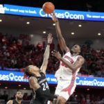 
              Houston forward Jarace Walker, right, shoots over Cincinnati guard Jeremiah Davenport (24) during the second half of an NCAA college basketball game, Saturday, Jan. 28, 2023, in Houston. (AP Photo/Eric Christian Smith)
            