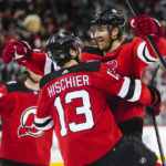 
              New Jersey Devils' Dougie Hamilton, right, celebrates with teammate Nico Hischier, center after scoring the game-winning goal during the overtime period of an NHL hockey game, Sunday, Jan. 22, 2023, in Newark, N.J. The Devils won 2-1. (AP Photo/Frank Franklin II)
            