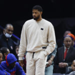 
              Los Angeles Clippers guard Paul George, center, walks to the bench during the second half of an NBA basketball game against the Cleveland Cavaliers, Sunday, Jan. 29, 2023, in Cleveland. George did not play against the Cavaliers. (AP Photo/Ron Schwane)
            
