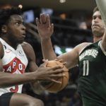 
              Toronto Raptors' O.G. Anunoby looks to shoot past Milwaukee Bucks' Brook Lopez during the first half of an NBA basketball game Tuesday, Jan. 17, 2023, in Milwaukee. (AP Photo/Morry Gash)
            