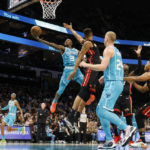 
              Charlotte Hornets guard Terry Rozier (3) drives to the basket against the Miami Heat during the first half of an NBA basketball game in Charlotte, N.C., Sunday, Jan. 29, 2023. (AP Photo/Nell Redmond)
            