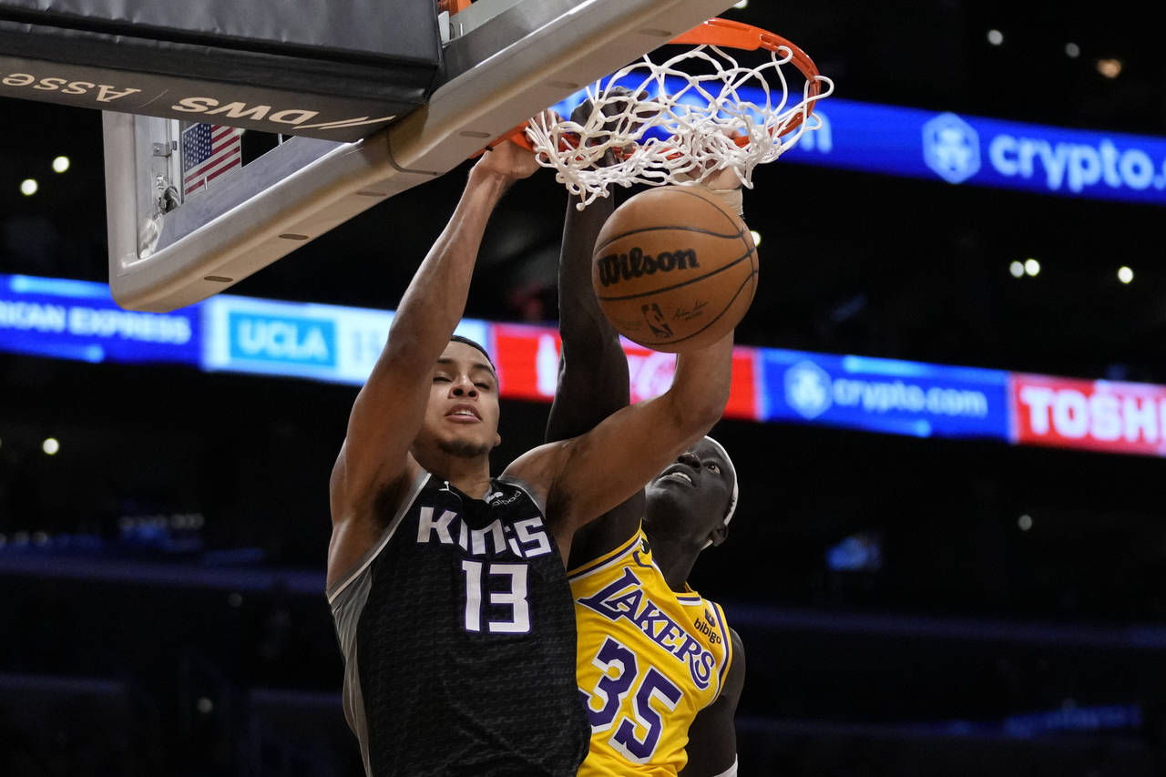 Sacramento Kings forward Keegan Murray (13) dunks against Los Angeles Lakers forward Wenyen Gabriel...