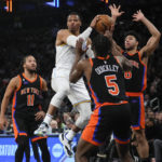 
              Los Angeles Lakers' Russell Westbrook, center, passes away from New York Knicks' Jalen Brunson (11), Immanuel Quickley (5) and Quentin Grimes (6) during the second half of an NBA basketball game Tuesday, Jan. 31, 2023, in New York. (AP Photo/Frank Franklin II)
            