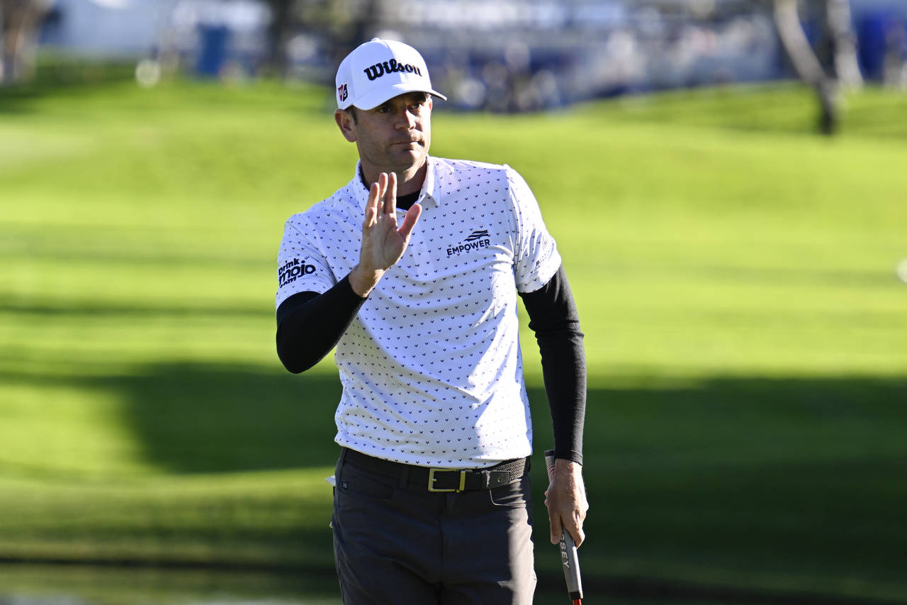 Sam Ryder acknowledges the gallery after finishing his round on the 18th hole of the South Course a...