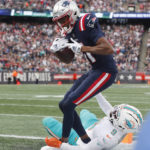 
              New England Patriots wide receiver Tyquan Thornton (11) beats Miami Dolphins cornerback Noah Igbinoghene (9) for a touchdown during the first half of an NFL football game, Sunday, Jan. 1, 2023, in Foxborough, Mass. (AP Photo/Michael Dwyer)
            