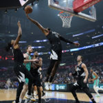
              Los Angeles Clippers guard Paul George (13) grabs a rebound during the first half of an NBA basketball game against the San Antonio Spurs in Los Angeles, Thursday, Jan. 26, 2023. (AP Photo/Ashley Landis)
            