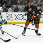 
              Anaheim Ducks center Mason McTavish (37) shoots past San Jose Sharks left wing Evgeny Svechnikov (10) for a goal during the third period of an NHL hockey game in Anaheim, Calif., Friday, Jan. 6, 2023. (AP Photo/Kyusung Gong)
            