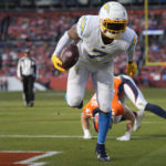 
              Los Angeles Chargers tight end Gerald Everett (7) scores a touchdown after making a catch against the Denver Broncos during the first half of an NFL football game in Denver, Sunday, Jan. 8, 2023. (AP Photo/David Zalubowski)
            