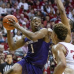 
              Northwestern guard Chase Audige (1) attempts to make a pass during the first half an NCAA college basketball game against Indiana, Sunday, Jan. 8, 2023, in Bloomington, Ind. (AP Photo/Doug McSchooler)
            