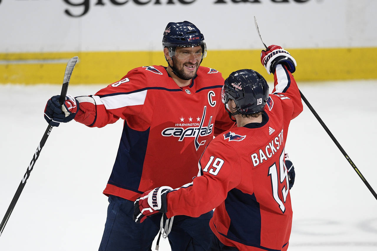 FILE - Washington Capitals left wing Alex Ovechkin (8), of Russia, celebrates his third goal of the...