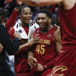 
              Cleveland Cavaliers guard Donovan Mitchell (45) celebrates with teammates after making a basket to tie an NBA basketball game during the second half against the Chicago Bulls, Monday, Jan. 2, 2023, in Cleveland. (AP Photo/Ron Schwane)
            