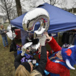 
              Tailgaters set up an inflated number 3 balloon in support of Buffalo Bills safety Damar Hamlin near Highmark Stadium before an NFL football game against the New England Patriots, Sunday, Jan. 8, 2023, in Orchard Park, N.Y. Hamlin remains hospitalized after suffering a catastrophic on-field collapse in the team's previous game against the Cincinnati Bengals. (AP Photo/Adrian Kraus)
            