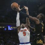 
              Cleveland Cavaliers' Caris LeVert, right, drives past New York Knicks' RJ Barrett (9) during the first half of an NBA basketball game Tuesday, Jan. 24, 2023, in New York. (AP Photo/Frank Franklin II)
            