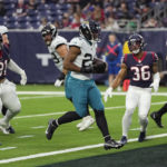 
              Jacksonville Jaguars running back Snoop Conner (24) scores a touchdown against the Houston Texans during the second half of an NFL football game in Houston, Sunday, Jan. 1, 2023. (AP Photo/David J. Phillip)
            