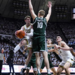 
              Purdue guard Braden Smith (3) makes a pass around Michigan State forward Joey Hauser (10) during the second half of an NCAA college basketball game in West Lafayette, Ind., Sunday, Jan. 29, 2023. Purdue defeated Michigan State 77-61. (AP Photo/Michael Conroy)
            