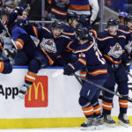 
              New York Islanders center Mathew Barzal (13) is congratulated by Jean-Gabriel Pageau (44) and teammates after scoring the game winning goal in overtime in an NHL hockey game against the Vegas Golden Knights on Saturday, Jan. 28, 2023, in Elmont, N.Y. The Islanders won 2-1 in overtime. (AP Photo/Adam Hunger)
            