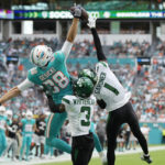
              Miami Dolphins tight end Mike Gesicki (88) is unable to grab a pass in the end zone as New York Jets cornerback Sauce Gardner (1) and safety Jordan Whitehead (3) defend during the first half of an NFL football game, Sunday, Jan. 8, 2023, in Miami Gardens, Fla. (AP Photo/Rebecca Blackwell)
            