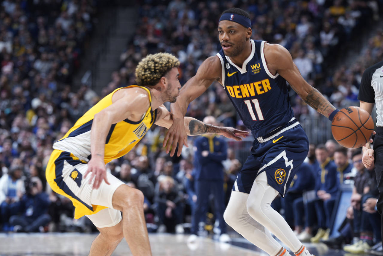 Denver Nuggets forward Bruce Brown is defended by Indiana Pacers guard Chris Duarte during the seco...