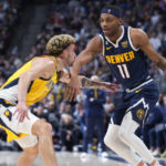 
              Denver Nuggets forward Bruce Brown is defended by Indiana Pacers guard Chris Duarte during the second half of an NBA basketball game Friday, Jan. 20, 2023, in Denver. (AP Photo/David Zalubowski)
            