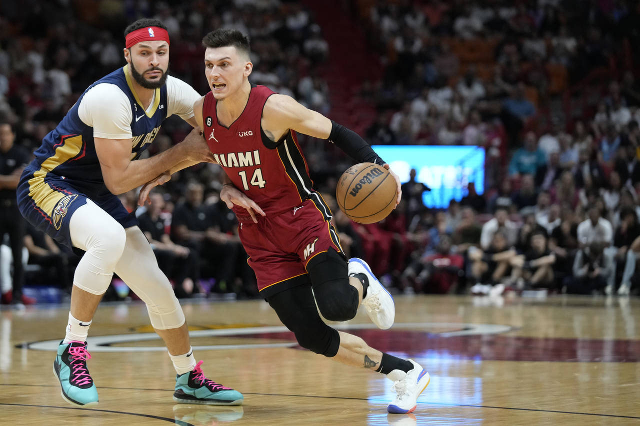 Miami Heat guard Tyler Herro (14) drives to the basket against New Orleans Pelicans forward Larry N...
