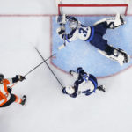 
              Winnipeg Jets goaltender David Rittich (33) dives to make a save on a shot from Philadelphia Flyers' Kevin Hayes during the second period of an NHL hockey game, Sunday, Jan. 22, 2023, in Philadelphia. (AP Photo/Derik Hamilton)
            