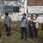 
              Archers and spectators gather to hear the result after the first round of an archery event in Shillong, India, Monday, Jan. 16, 2023. Each afternoon, except on Sundays and public holidays, this event takes place in a small field and people place bets on the results. (AP Photo/Ashwini Bhatia)
            
