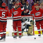
              Carolina Hurricanes' Jalen Chatfield (5) celebrates his goal against the Minnesota Wild with Calvin de Haan, center, and Paul Stastny (26) in front of Wild goaltender Marc-Andre Fleury (29) during the third period of an NHL hockey game in Raleigh, N.C., Thursday, Jan. 19, 2023. (AP Photo/Karl B DeBlaker)
            