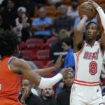 
              Miami Heat forward Jamal Cain, right, takes a shot against Oklahoma City Thunder guard Jalen Williams during the first half of an NBA basketball game, Tuesday, Jan. 10, 2023, in Miami. (AP Photo/Wilfredo Lee)
            