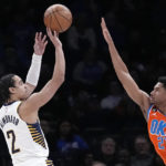 
              Indiana Pacers guard Andrew Nembhard (2) shoots over Oklahoma City Thunder guard Aaron Wiggins (21) in the first half of an NBA basketball game Wednesday, Jan. 18, 2023, in Oklahoma City. (AP Photo/Sue Ogrocki)
            