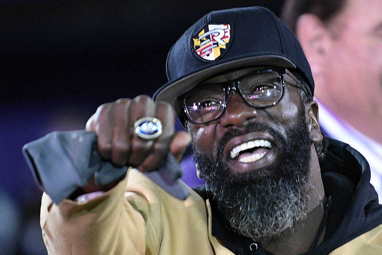 FILE - In this Nov. 3, 2019, file photo, former Baltimore Ravens safety Ed Reed displays his Pro Fo...