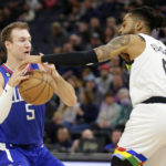 
              Los Angeles Clippers guard Luke Kennard (5) has the ball knocked loose by Minnesota Timberwolves guard D'Angelo Russell (0) during the first half of an NBA basketball game Friday, Jan. 6, 2023, in Minneapolis. (AP Photo/Andy Clayton-King)
            