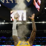 
              Los Angeles Lakers forward LeBron James (6) throws powdered chalk in the air before an NBA basketball game against the Sacramento Kings in Los Angeles, Wednesday, Jan. 18, 2023. (AP Photo/Ashley Landis)
            