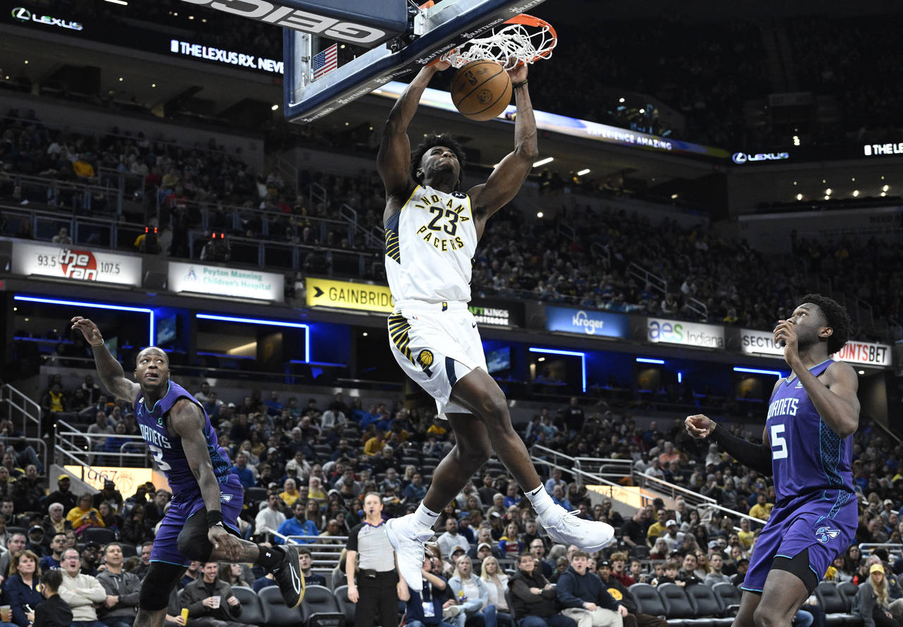 Indiana Pacers forward Aaron Nesmith (23) dunks the ball during the second half of an NBA basketbal...