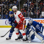 
              Detroit Red Wings center Michael Rasmussen (27) fights for position with Toronto Maple Leafs defenseman Timothy Liljegren (37) and goaltender Ilya Samsonov (35) during the third period of an NHL hockey game Saturday, Jan. 7, 2023, in Toronto. (Christopher Katsarov/The Canadian Press via AP)
            