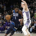 
              Minnesota Timberwolves guard Anthony Edwards (1) works toward the basket while defended by Sacramento Kings guard Kevin Huerter, right, during the first half of an NBA basketball game, Monday, Jan. 30, 2023, in Minneapolis. (AP Photo/Abbie Parr)
            
