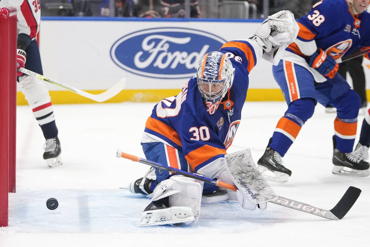 New York Islanders goaltender Ilya Sorokin (30) reacts after a puck shot past him for a goal by Was...
