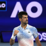 
              Novak Djokovic of Serbia reacts after winning a point against Andrey Rublev of Russia during their quarterfinal match at the Australian Open tennis championship in Melbourne, Australia, Wednesday, Jan. 25, 2023. (AP Photo/Ng Han Guan)
            