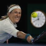 
              Victoria Azarenka of Belarus plays a backhand return to Zhu Lin of China during their fourth round match at the Australian Open tennis championship in Melbourne, Australia, Monday, Jan. 23, 2023. (AP Photo/Ng Han Guan)
            