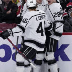 
              Los Angeles Kings center Jaret Anderson-Dolan (28) celebrates with center Blake Lizotte (46) and defenseman Tobias Bjornfot after scoring during the first period of an NHL hockey game against the Chicago Blackhawks in Chicago, Sunday, Jan. 22, 2023. (AP Photo/Nam Y. Huh)
            